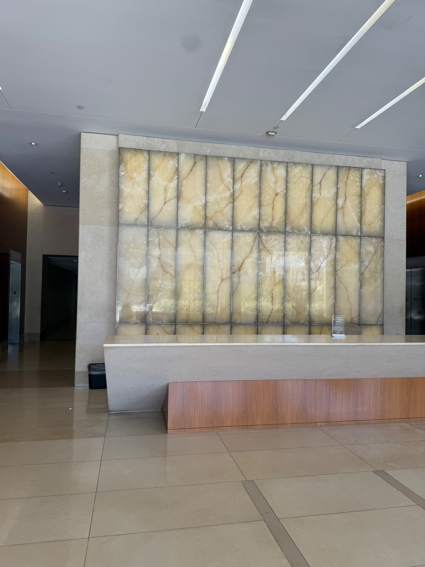 Royal Hyperbarics lobby interior with backlit onyx wall